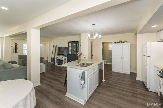 6451 Odell St, Saint Louis, MO 63139 - kitchen with freestanding refrigerator, open floor plan, light countertops, dishwasher, and recessed lighting