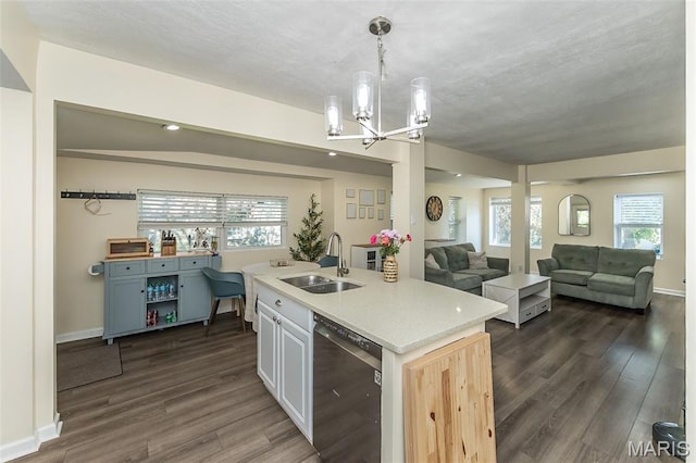 6451 Odell St, Saint Louis, MO 63139 - kitchen with dishwasher, dark wood finished floors, a chandelier, and open floor plan
