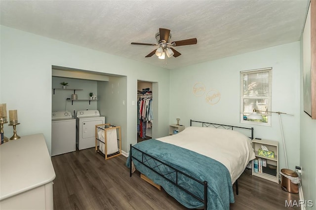 6451 Odell St, Saint Louis, MO 63139 - bedroom featuring washer and clothes dryer, dark wood-type flooring, a closet, a textured ceiling, and a ceiling fan