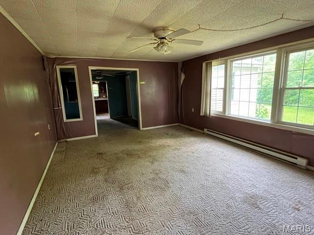 16847 State Highway Af, Dexter, MO 63841 - empty room featuring a baseboard heating unit, a ceiling fan, and carpet flooring