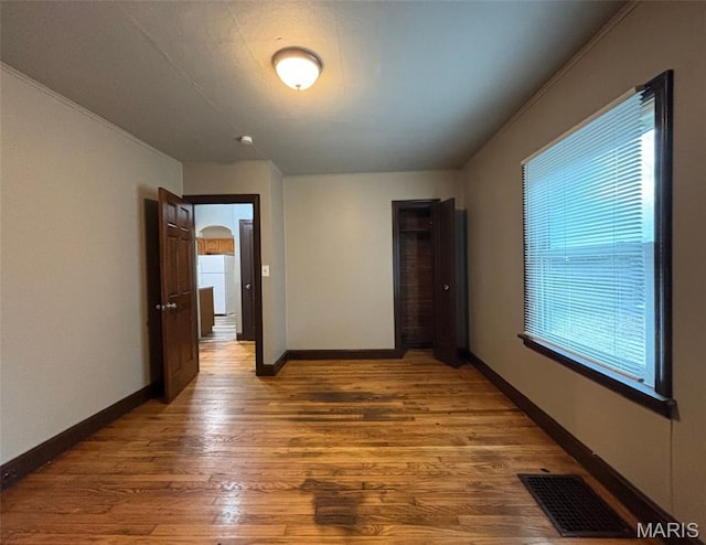 9758 Diamond Dr, Riverview, MO 63137 - empty room with wood finished floors and baseboards