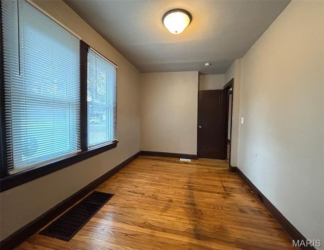 9758 Diamond Dr, Riverview, MO 63137 - empty room featuring baseboards and wood finished floors