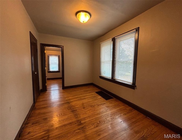 9758 Diamond Dr, Riverview, MO 63137 - spare room featuring wood finished floors