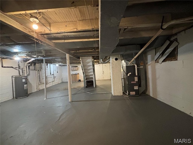9758 Diamond Dr, Riverview, MO 63137 - unfinished basement with water heater, concrete block wall, and heating unit
