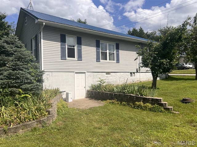 315 E N St, Saint Clair, MO 63077 - view of side of property with a lawn and a metal roof