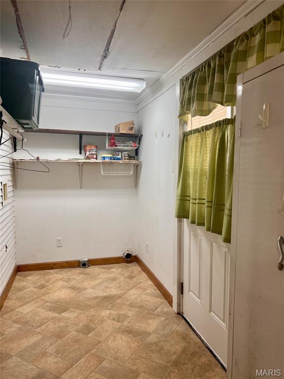315 E N St, Saint Clair, MO 63077 - laundry room with baseboards and stone finish flooring