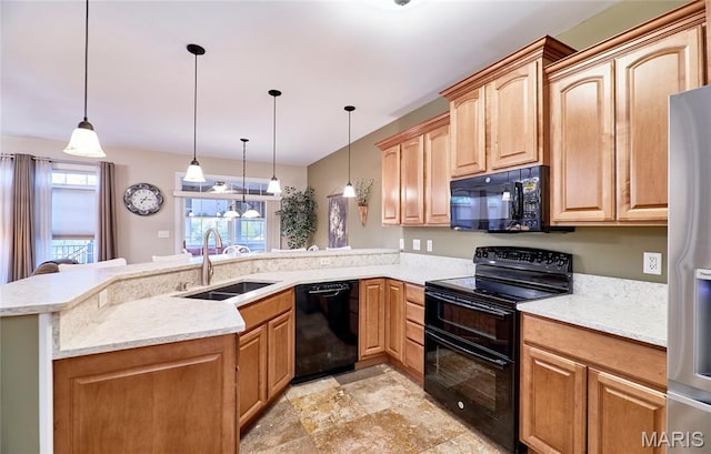 2421 Golden Bear Way Unit 731A, Wentzville, MO 63385 - kitchen featuring black appliances, a peninsula, decorative light fixtures, light stone counters, and stone finish floors