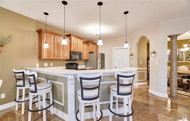2421 Golden Bear Way Unit 731A, Wentzville, MO 63385 - kitchen featuring black appliances, a peninsula, a breakfast bar area, and arched walkways
