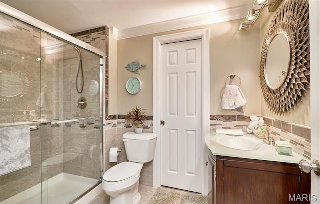 2421 Golden Bear Way Unit 731A, Wentzville, MO 63385 - bathroom with tile walls, vanity, crown molding, a wainscoted wall, and a stall shower