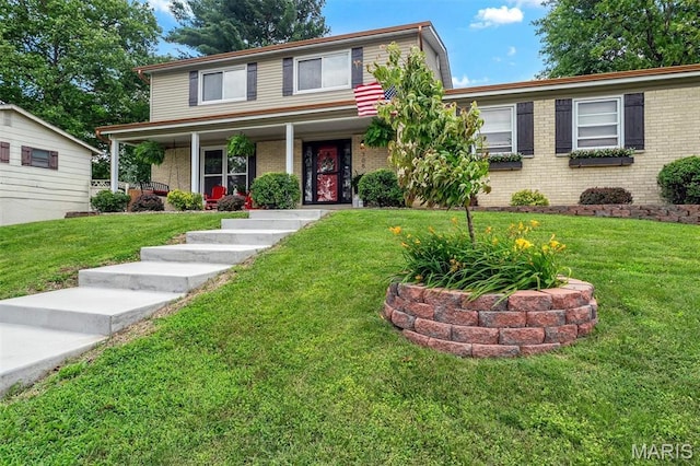 308 Rebecca Dr, Saint Charles, MO 63301 - traditional home featuring brick siding, a porch, and a front lawn