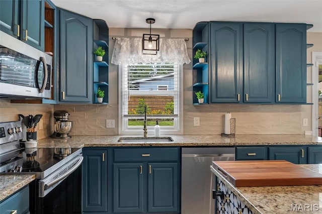 308 Rebecca Dr, Saint Charles, MO 63301 - kitchen with open shelves, appliances with stainless steel finishes, blue cabinets, and tasteful backsplash