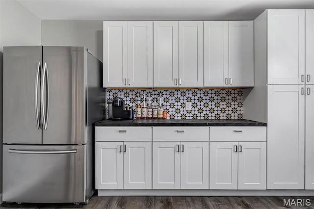 308 Rebecca Dr, Saint Charles, MO 63301 - kitchen with freestanding refrigerator, dark countertops, and white cabinets