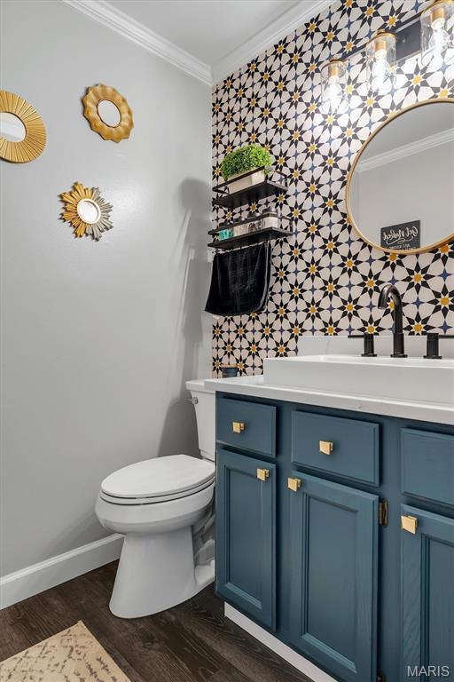 308 Rebecca Dr, Saint Charles, MO 63301 - bathroom with wallpapered walls, crown molding, vanity, wood finished floors, and an accent wall