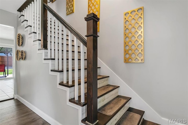 308 Rebecca Dr, Saint Charles, MO 63301 - stairway featuring baseboards and wood finished floors