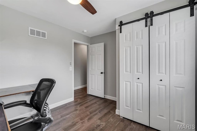 308 Rebecca Dr, Saint Charles, MO 63301 - home office featuring a barn door, ceiling fan, and dark wood-style floors