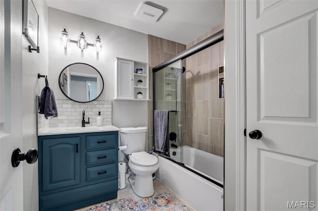 308 Rebecca Dr, Saint Charles, MO 63301 - bathroom featuring vanity, tasteful backsplash, combined bath / shower with glass door, and tile patterned flooring