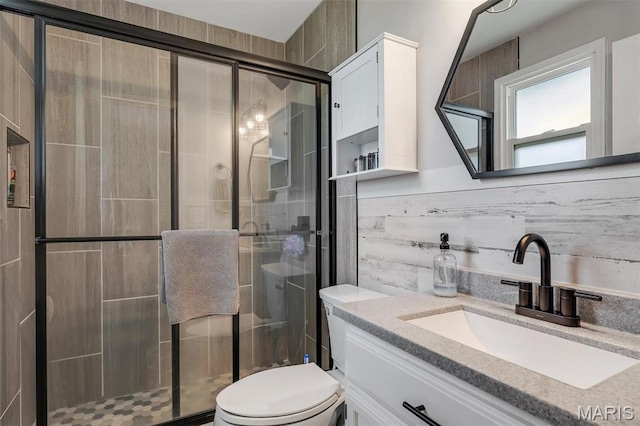 308 Rebecca Dr, Saint Charles, MO 63301 - bathroom with vanity, a shower stall, and tasteful backsplash