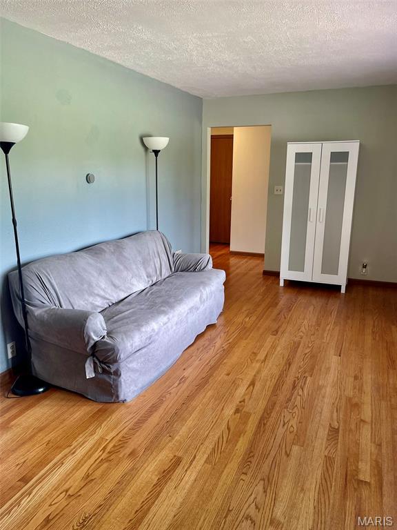 12 Dee, Moro, IL 62067 - living room with wood finished floors and a textured ceiling