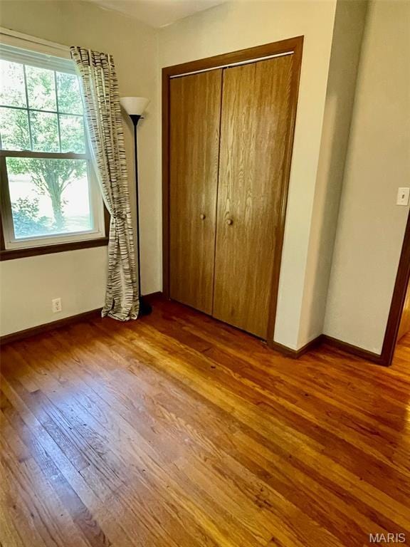 12 Dee, Moro, IL 62067 - unfurnished bedroom with wood-type flooring and a closet