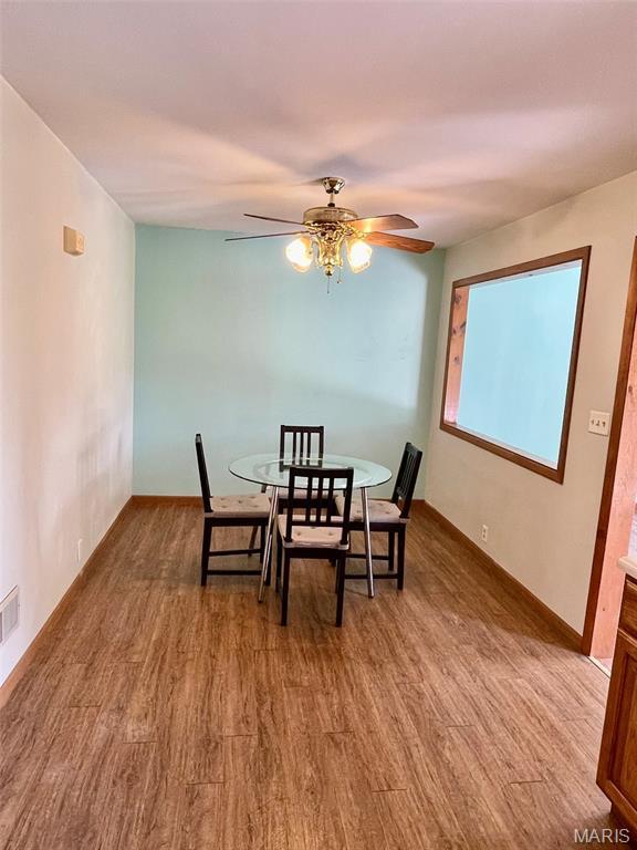 12 Dee, Moro, IL 62067 - dining area with wood finished floors and a ceiling fan