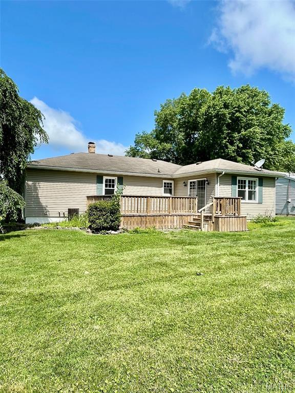 12 Dee, Moro, IL 62067 - rear view of house featuring a deck, a yard, and a chimney