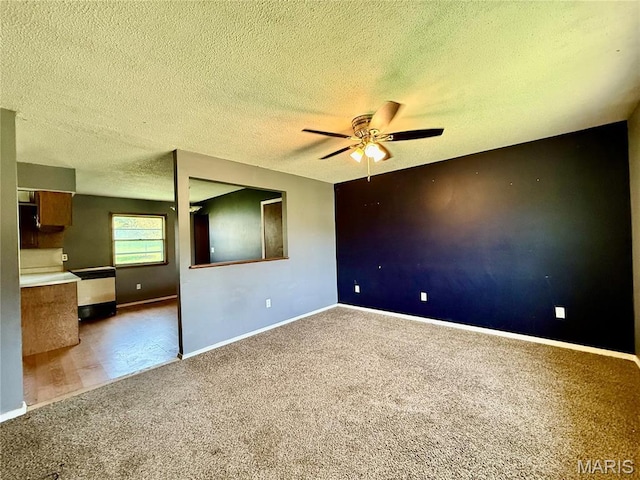 1206 Virginia Ave, Canton, MO 63435 - spare room with a ceiling fan, carpet floors, and a textured ceiling