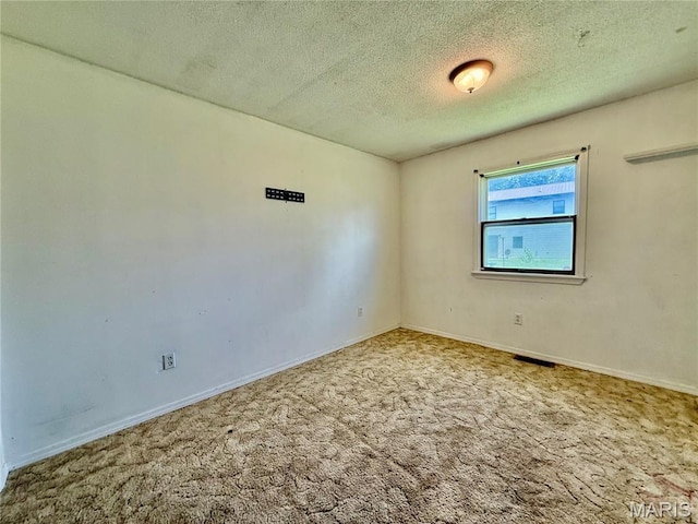 1206 Virginia Ave, Canton, MO 63435 - carpeted spare room with a textured ceiling and baseboards