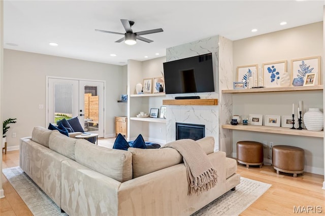 6297 Magnolia Ave, Saint Louis, MO 63139 - living area with a ceiling fan, wood finished floors, a high end fireplace, and recessed lighting