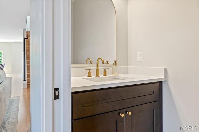6297 Magnolia Ave, Saint Louis, MO 63139 - bathroom with wood finished floors and vanity