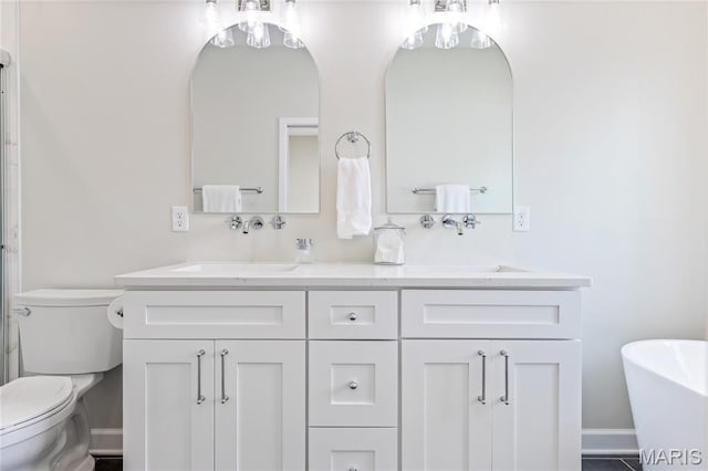 6297 Magnolia Ave, Saint Louis, MO 63139 - bathroom featuring double vanity and a freestanding tub