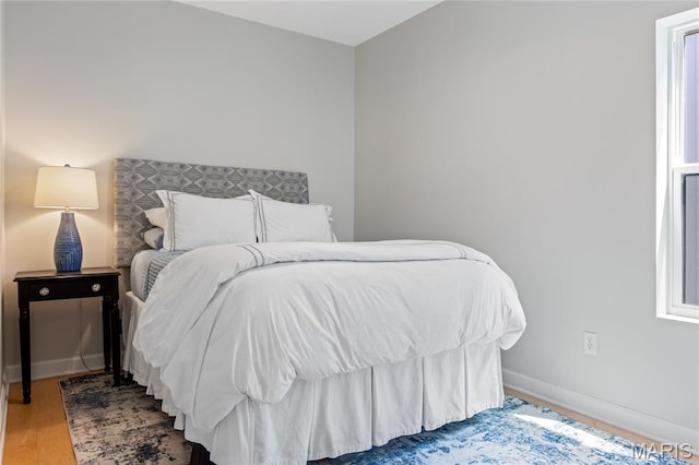 6297 Magnolia Ave, Saint Louis, MO 63139 - bedroom with wood finished floors and baseboards