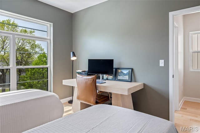6297 Magnolia Ave, Saint Louis, MO 63139 - bedroom featuring wood finished floors and a desk