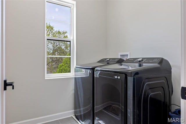 6297 Magnolia Ave, Saint Louis, MO 63139 - washroom with washer and dryer and tile patterned floors
