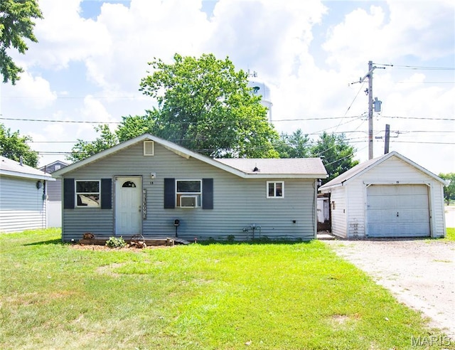 15 S 13th St, Wood River, IL 62095 - view of front of home with gravel driveway, an outdoor structure, a garage, a front yard, and cooling unit