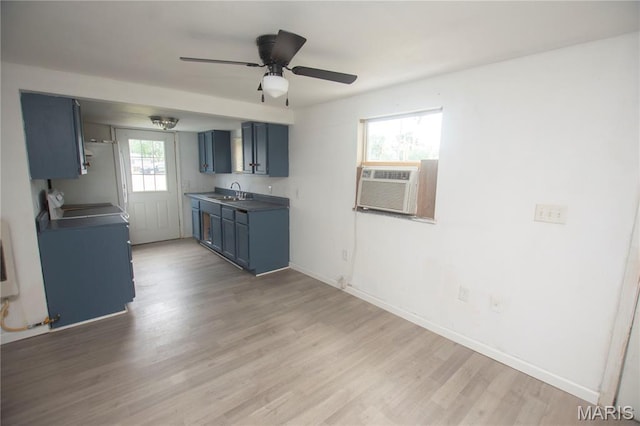 15 S 13th St, Wood River, IL 62095 - kitchen featuring blue cabinets, light wood-type flooring, ceiling fan, cooling unit, and range