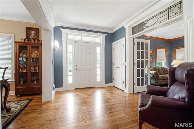 2175 Oberhelman Rd, Foristell, MO 63348 - entryway featuring wood finished floors, healthy amount of natural light, and ornamental molding