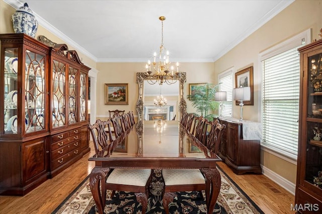 2175 Oberhelman Rd, Foristell, MO 63348 - dining space with a chandelier, light wood-style flooring, and ornamental molding