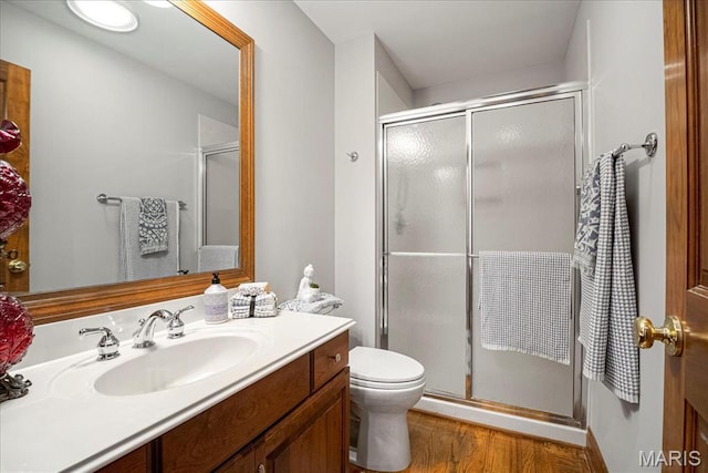 2175 Oberhelman Rd, Foristell, MO 63348 - bathroom featuring vanity, a shower stall, and wood finished floors