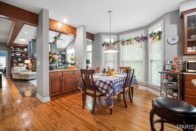 2175 Oberhelman Rd, Foristell, MO 63348 - dining room with light wood-style flooring, a ceiling fan, and vaulted ceiling
