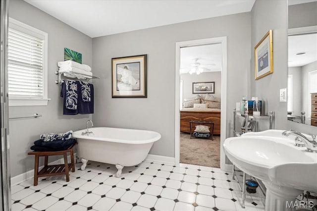 2175 Oberhelman Rd, Foristell, MO 63348 - full bath with tile patterned floors, a freestanding bath, connected bathroom, and ceiling fan