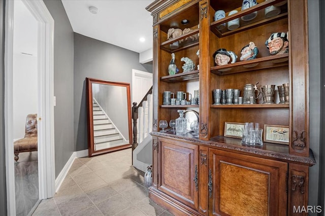 2175 Oberhelman Rd, Foristell, MO 63348 - bar area featuring stairway and baseboards