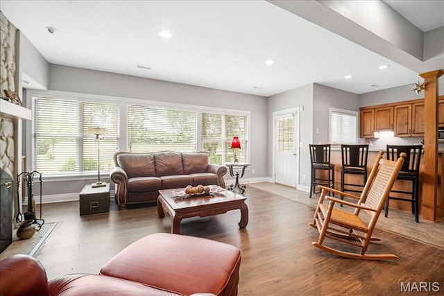 2175 Oberhelman Rd, Foristell, MO 63348 - living room with plenty of natural light, light wood-style flooring, recessed lighting, and a fireplace