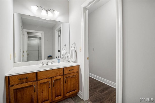 2175 Oberhelman Rd, Foristell, MO 63348 - bathroom featuring vanity, a stall shower, and wood finished floors