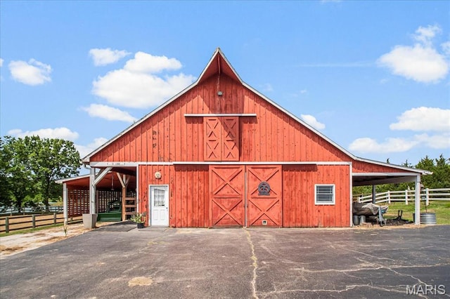 2175 Oberhelman Rd, Foristell, MO 63348 - view of barn featuring asphalt driveway and an exterior structure
