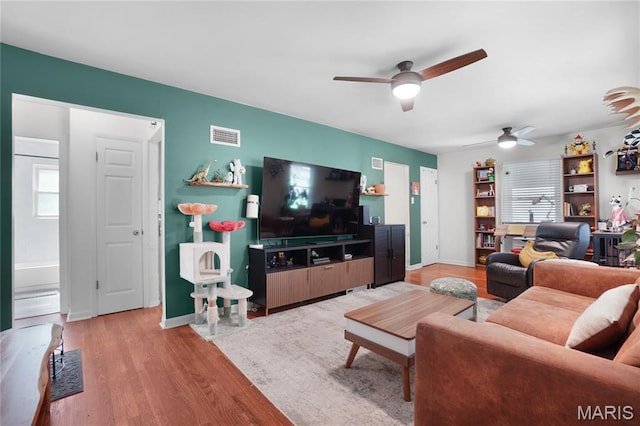 10502 Kamping Ln, Saint Louis, MO 63123 - living room with ceiling fan, light wood-type flooring, and healthy amount of natural light