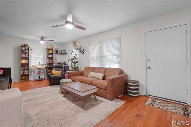 10502 Kamping Ln, Saint Louis, MO 63123 - living area featuring wood finished floors, ceiling fan, and a desk