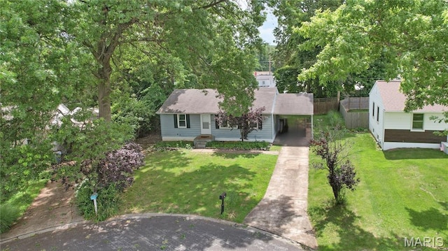 10502 Kamping Ln, Saint Louis, MO 63123 - view of front facade with driveway, a front lawn, and a carport