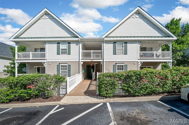 1141 Arbor Creek Dr Unit 2C, Saint Louis, MO 63122 - view of building exterior featuring uncovered parking