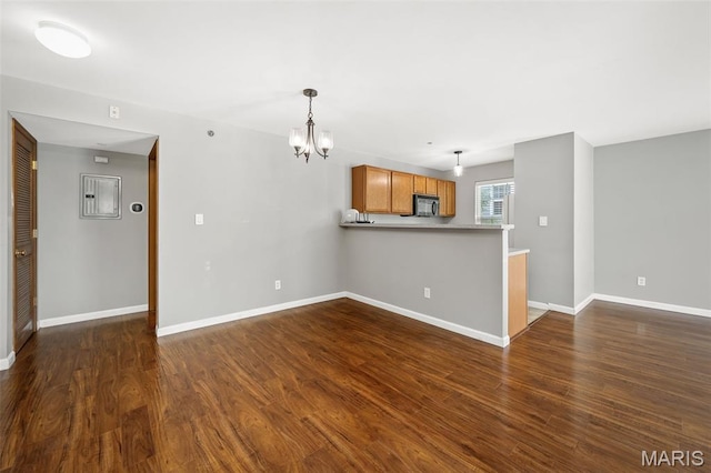 1141 Arbor Creek Dr Unit 2C, Saint Louis, MO 63122 - unfurnished living room with a chandelier and dark wood-style flooring