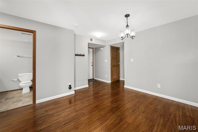 1141 Arbor Creek Dr Unit 2C, Saint Louis, MO 63122 - unfurnished room with a chandelier, wood finished floors, and a smoke detector